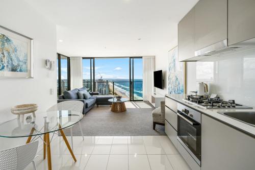 a kitchen and living room with a view of the ocean at Rhapsody Resort - Official in Gold Coast