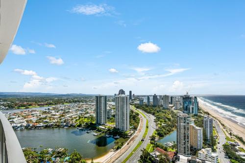 an aerial view of a city and the ocean at Rhapsody Resort - Official in Gold Coast