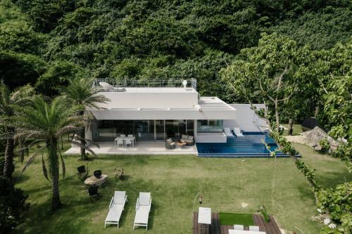an aerial view of a house with a yard at THE PANALI in Miyako Island