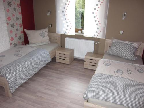 Ένα ή περισσότερα κρεβάτια σε δωμάτιο στο Ferienhaus Fanny