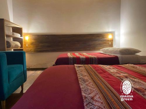 a hotel room with two beds and a chair at MAMA GREEN Veggie Hostal & Permaculture Farm in Urubamba