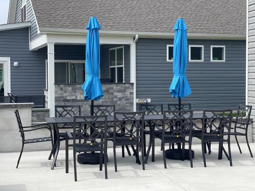 two blue umbrellas sitting on top of a table at Gorgeous Seaside Paradise - Ultimate Family Getaway! in Ocean View
