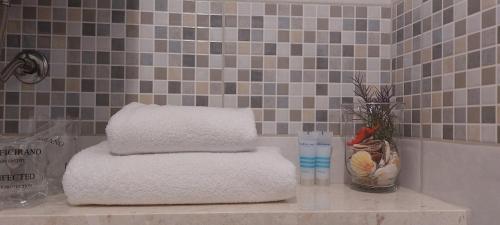 a pile of towels on a counter in a bathroom at Antea in Split