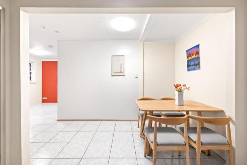 a dining room with a table and chairs at Detached Single Room - Central Spot in Pymble - Shared Bathroom in Pymble