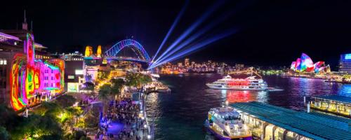a city lit up at night with boats in the water at Detached Single Room - Central Spot in Pymble - Shared Bathroom in Pymble