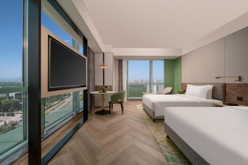 Postel nebo postele na pokoji v ubytování Holiday Inn Shijiazhuang High-tech Zone by IHG