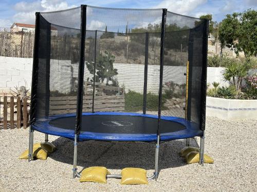 a trampoline with a blue top on at Garten und Pool in San Vicente del Raspeig