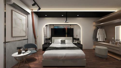 Schlafzimmer mit einem Bett, einem Tisch und Stühlen in der Unterkunft M&H Hotel in Ho-Chi-Minh-Stadt