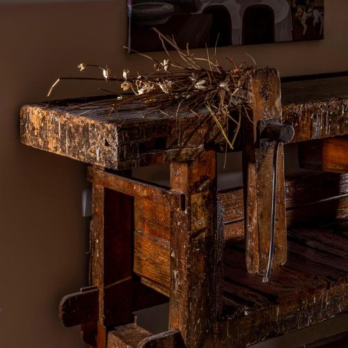 a wooden table with a plant on top of it at Il Castagneto Hotel in Melfi