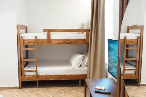Ένα ή περισσότερα κρεβάτια σε δωμάτιο στο Marina Rooms