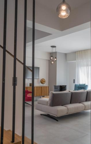 a living room with a couch and a table at Adaman Villas in Meganisi