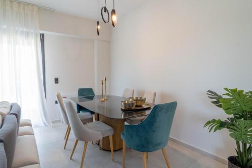 a dining room with a table and chairs at Adaman Villas in Meganisi