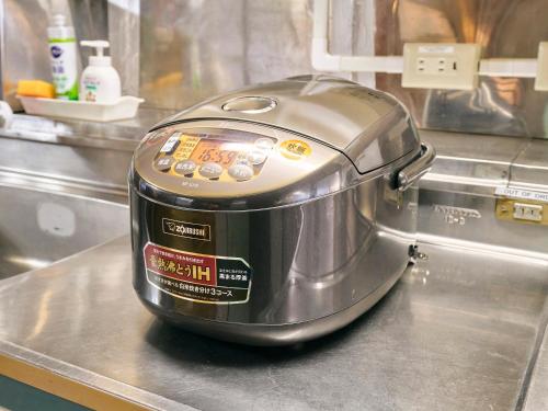 a toaster sitting on top of a kitchen counter at Kokoyui Guest House in Nachikatsuura