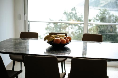 a bowl of food sitting on a table with chairs at Resort Stikovic in Dobra Voda