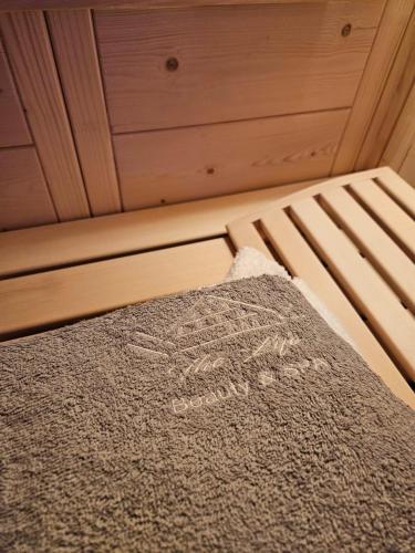 a bed in a room with a blanket on it at The Life in Marcellina