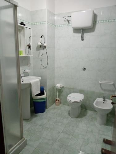 a bathroom with a toilet and a sink at Mamma Assunta in Melendugno