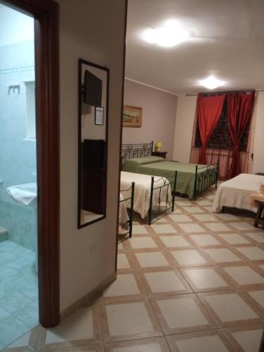 a room with two beds and a room with two beds at Mamma Assunta in Melendugno
