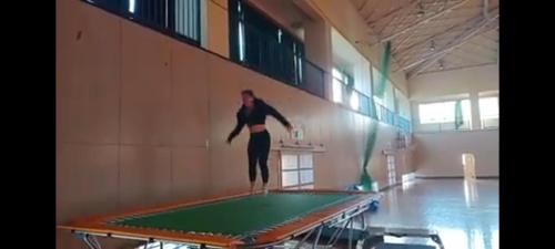 a woman standing on top of a trampoline at omusubi guest house (JAPANESE　STYLE） in Mamihara