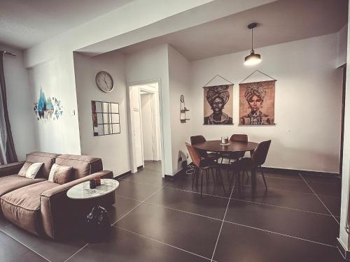 a living room with a couch and a table at Home Away One Bedroom Apartment in Nicosia in Nicosia