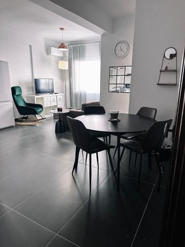 a dining room with a table and chairs in a room at Home Away One Bedroom Apartment in Nicosia in Nicosia
