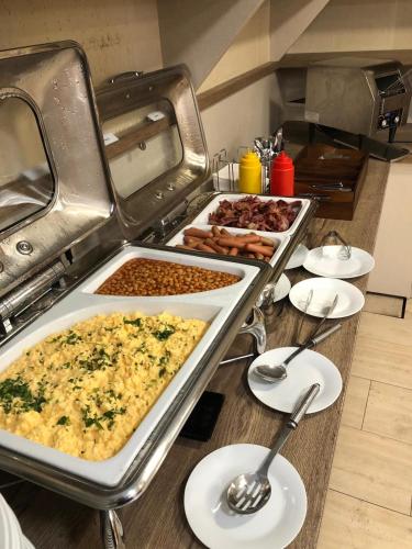 a buffet with many different types of food at Wellness Hotel Svachovka in Český Krumlov