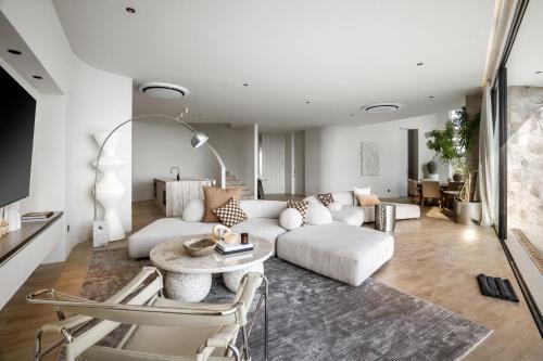 a living room with a couch and a table at Luxury 4BD Villa with Oceanview in Uluwatu in Uluwatu