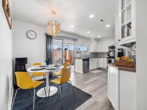 a kitchen and dining room with a table and chairs at Super Spacious Family Vacation House! in San Diego