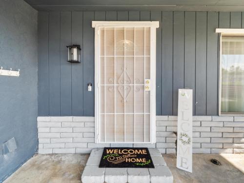 a door with a welcome sign in front of a house at Super Spacious Family Vacation House! in San Diego