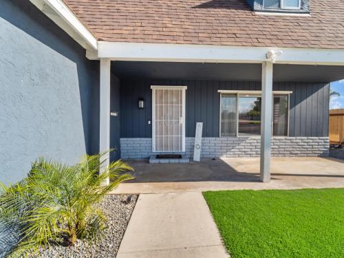 a house with a front door and a lawn at Super Spacious Family Vacation House! in San Diego