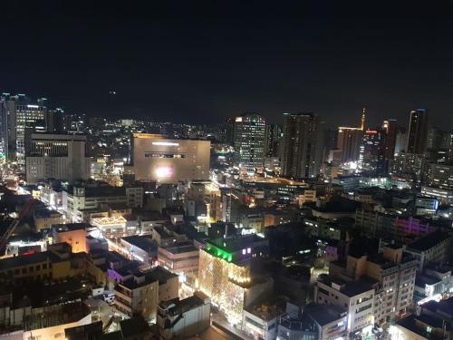 a view of a city at night with lights at Daon 동성로 스타비앤비 레지던스 in Daegu