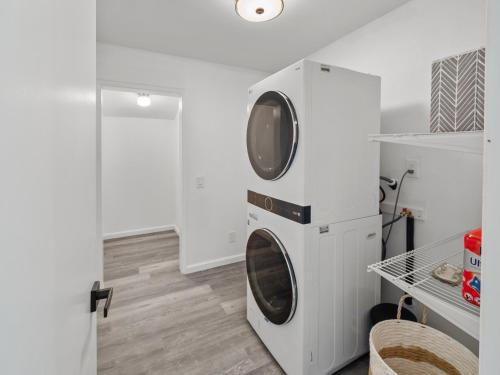 a washer and dryer in a white laundry room at Super Spacious Family Vacation House! in San Diego