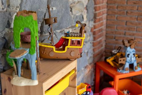 a toy boat sitting on top of a wooden table at Villa Vitali - Bellagio in Bellagio