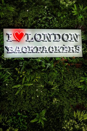 a sign on a bush with a heart on it at London Backpackers Youth Hostel 18 - 35 Years Old Only in London