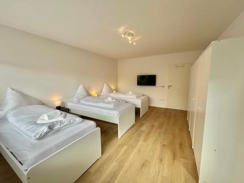 Ένα ή περισσότερα κρεβάτια σε δωμάτιο στο GuestHouse Bielefeld