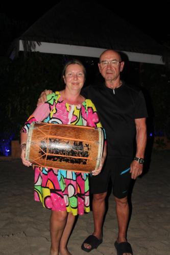 a man and a woman holding a largeophone at Sabba Summer Suite , Fodhdhoo in Fodhdhoo