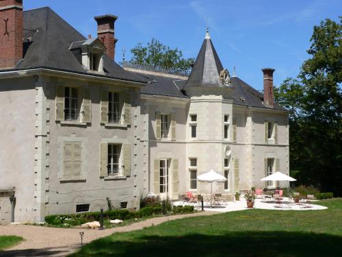 a large white house with a roof at Chateau de la Rozelle in Cellettes