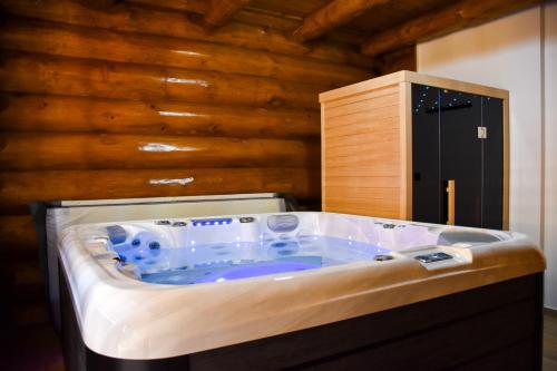a hot tub in the middle of a room at Villa Korina in Fužine