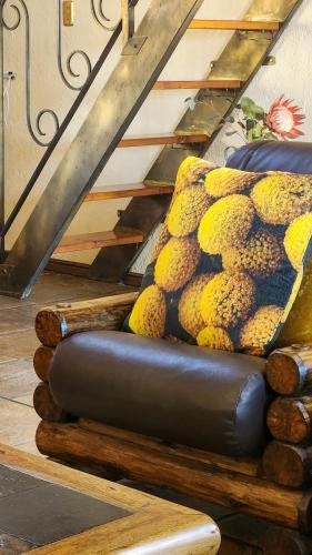 a chair sitting on top of logs with a staircase at Fossil Hills in McGregor