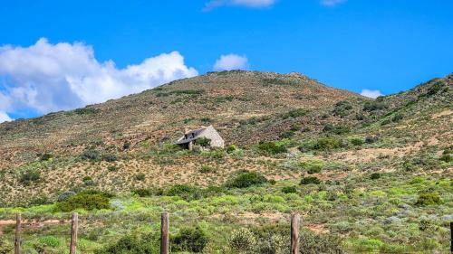an old house on the side of a hill at Fossil Hills in McGregor