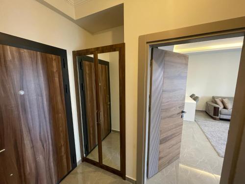 a room with a door and a living room at SA Apartments! 1bd Flat 300m to the Beach in Alanya