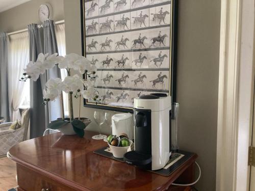 a coffee maker on top of a wooden table at Ballybur Lodge in Cuffesgrange