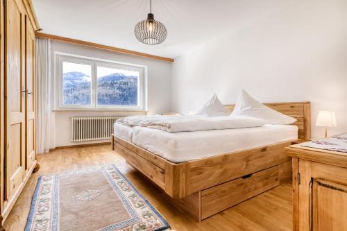 a bedroom with a bed and a window at Ferienhaus Walter in Nüziders