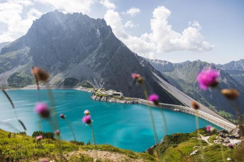 a view of a bridge over a lake in the mountains at Ferienhaus Walter in Nüziders