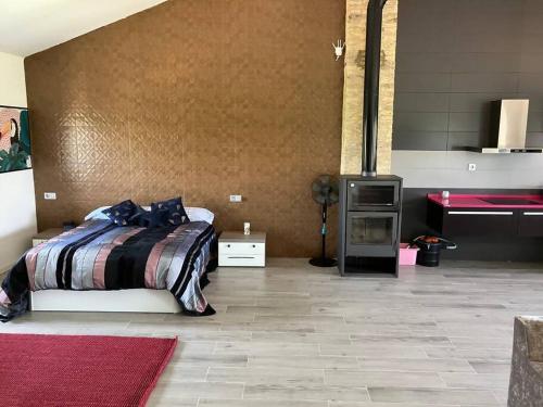 a bedroom with a bed and a table in it at Exclusivo Loft en Zaragoza-2 in Zaragoza