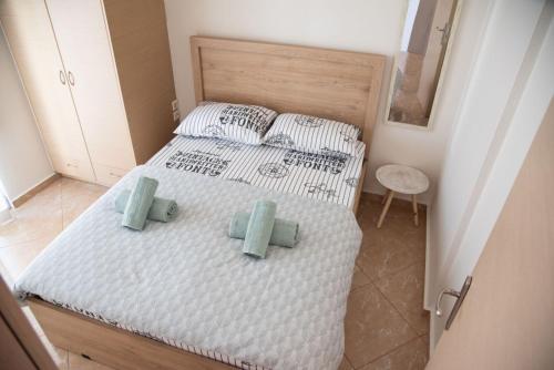 Ένα ή περισσότερα κρεβάτια σε δωμάτιο στο Modern apartment at Nea Artaki 2
