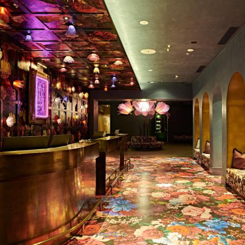 a bar in a restaurant with a colorful carpet at Naumi Hotel Wellington in Wellington