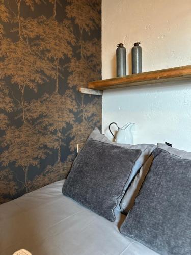 a bedroom with a bed with a vase on it at Brabantse Hoeve in Volkel