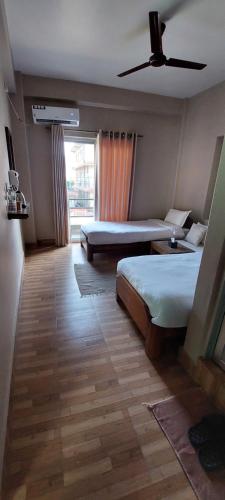 Postel nebo postele na pokoji v ubytování Hotel Blossom