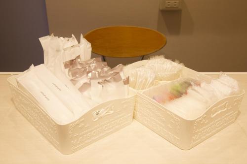 two plastic baskets sitting on a table at smart room tokyo koiwa city in Tokyo