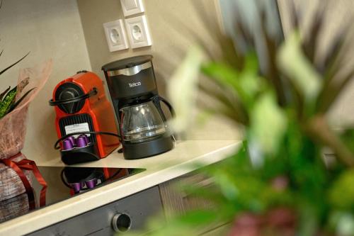 a coffee maker sitting on top of a counter at STEMA Kalymnos in Kalymnos